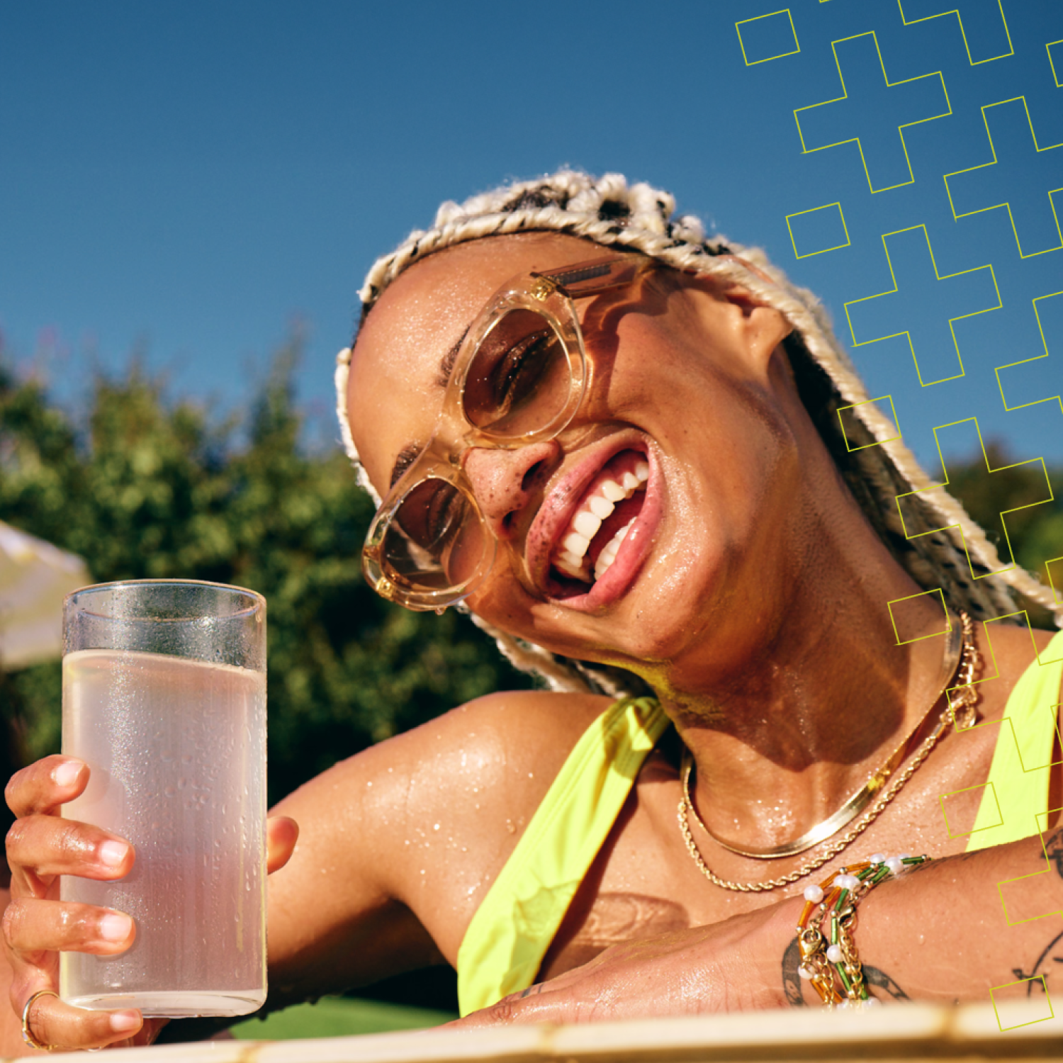 women smiles in the pool while enjoying hydration multiplier